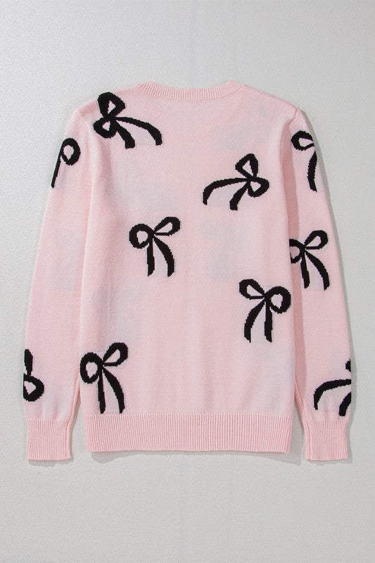 Pull de Noël rose clair à motif nœud tricoté et ample