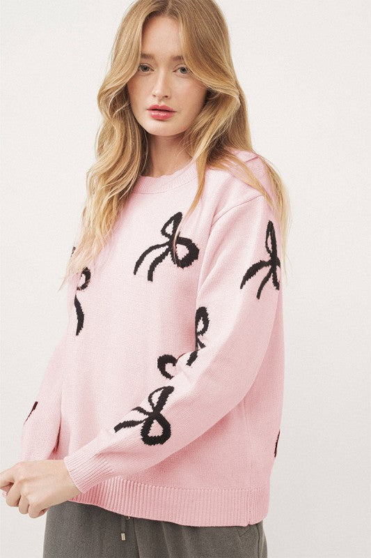 Pull de Noël rose clair à motif nœud tricoté et ample
