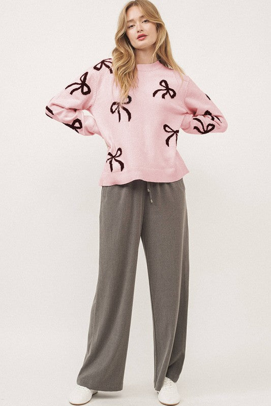 Pull de Noël rose clair à motif nœud tricoté et ample