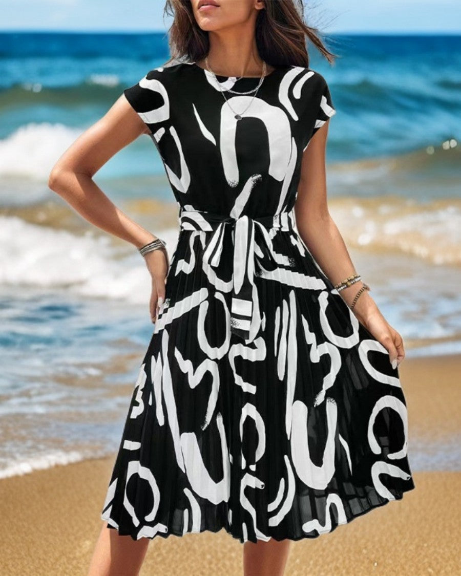 Onbely mi-longue robe trapèze imprimé à fleurie col rond manches courtes taille marquée mode vacances plage