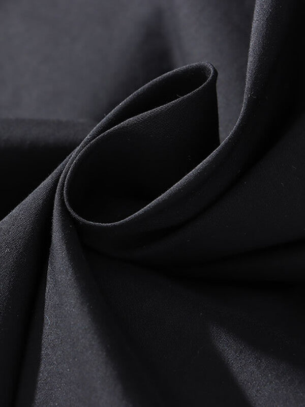 Onbely robe longue noir trapèze découpes.