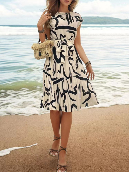 Onbely mi-longue robe trapèze imprimé à fleurie col rond manches courtes taille marquée mode vacances plage