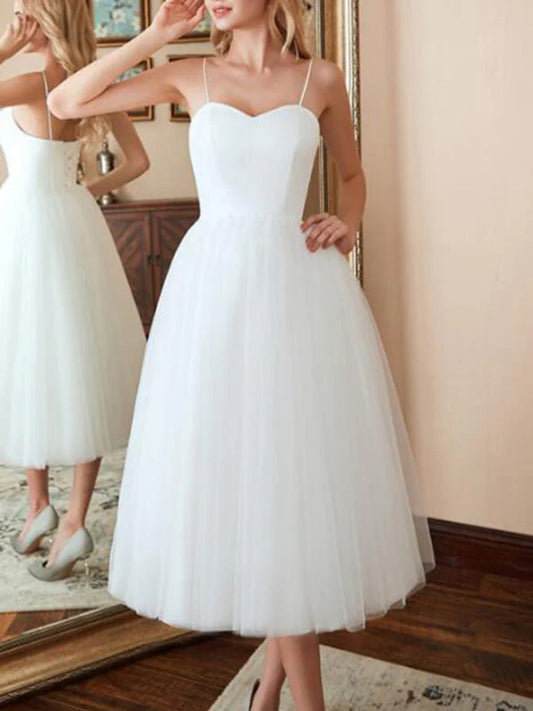 Onbely mi-longue robe trapèze unicolore tulle dos nu à fines brides col en V taille marquée élégant soirée cérémonie
