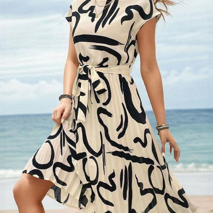 Onbely mi-longue robe trapèze imprimé à fleurie col rond manches courtes taille marquée mode vacances plage