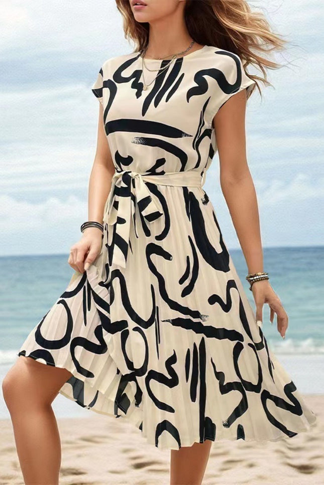 Onbely mi-longue robe trapèze imprimé à fleurie col rond manches courtes taille marquée mode vacances plage