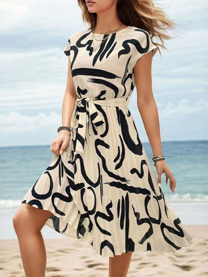 Onbely mi-longue robe trapèze imprimé à fleurie col rond manches courtes taille marquée mode vacances plage