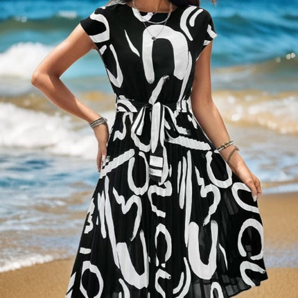 Onbely mi-longue robe trapèze imprimé à fleurie col rond manches courtes taille marquée mode vacances plage