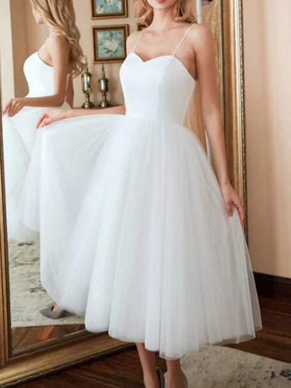 Onbely mi-longue robe trapèze unicolore tulle dos nu à fines brides col en V taille marquée élégant soirée cérémonie