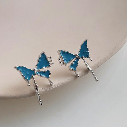 Bleu papillon des boucles d'oreilles mode - onbely