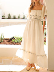 Onbely long dress with black trim, square neck, beige prom