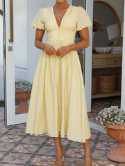 Onbely long dress with buttoned v-neck and puffed sleeves, elegant