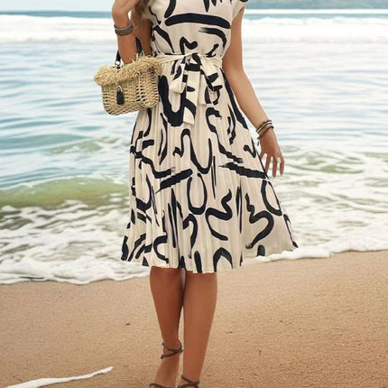 Onbely mi-longue robe trapèze imprimé à fleurie col rond manches courtes taille marquée mode vacances plage
